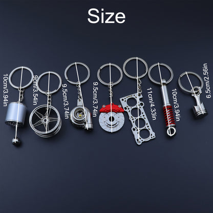 🗝️ 7-częściowy zestaw breloków tuningowych – Piston, Turbo, Wheel Hub, Gear Shift, Shock Absorber, Brake Disc, Engine Block – czarny, zinc alloy