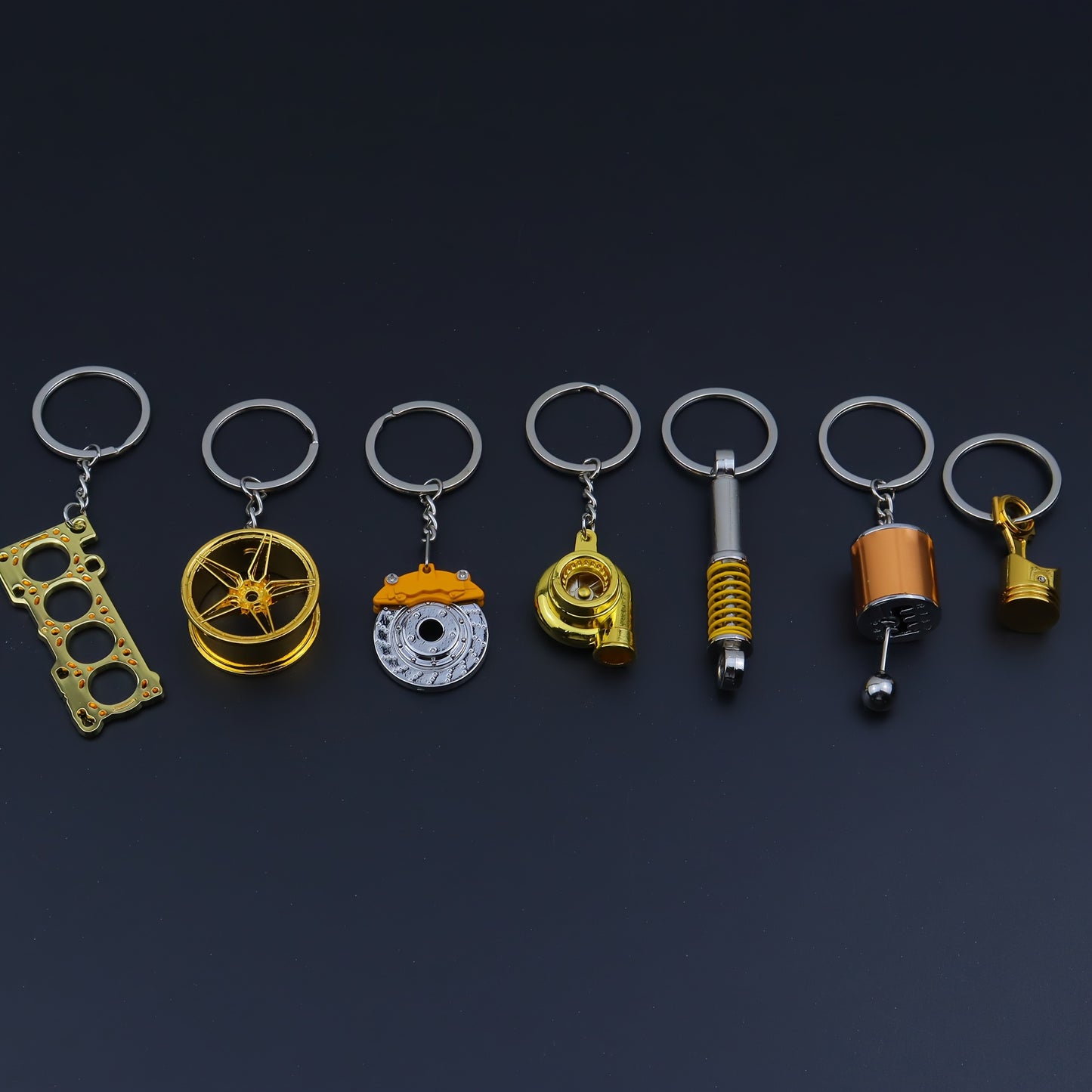 🗝️ 7-częściowy zestaw breloków tuningowych – Piston, Turbo, Wheel Hub, Gear Shift, Shock Absorber, Brake Disc, Engine Block – czarny, zinc alloy