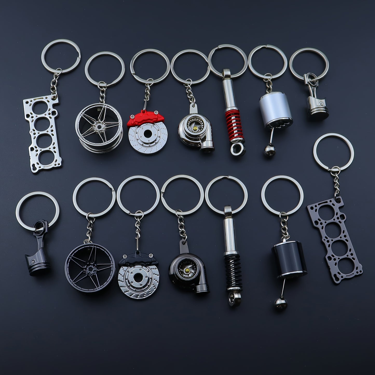 🗝️ 7-częściowy zestaw breloków tuningowych – Piston, Turbo, Wheel Hub, Gear Shift, Shock Absorber, Brake Disc, Engine Block – czarny, zinc alloy